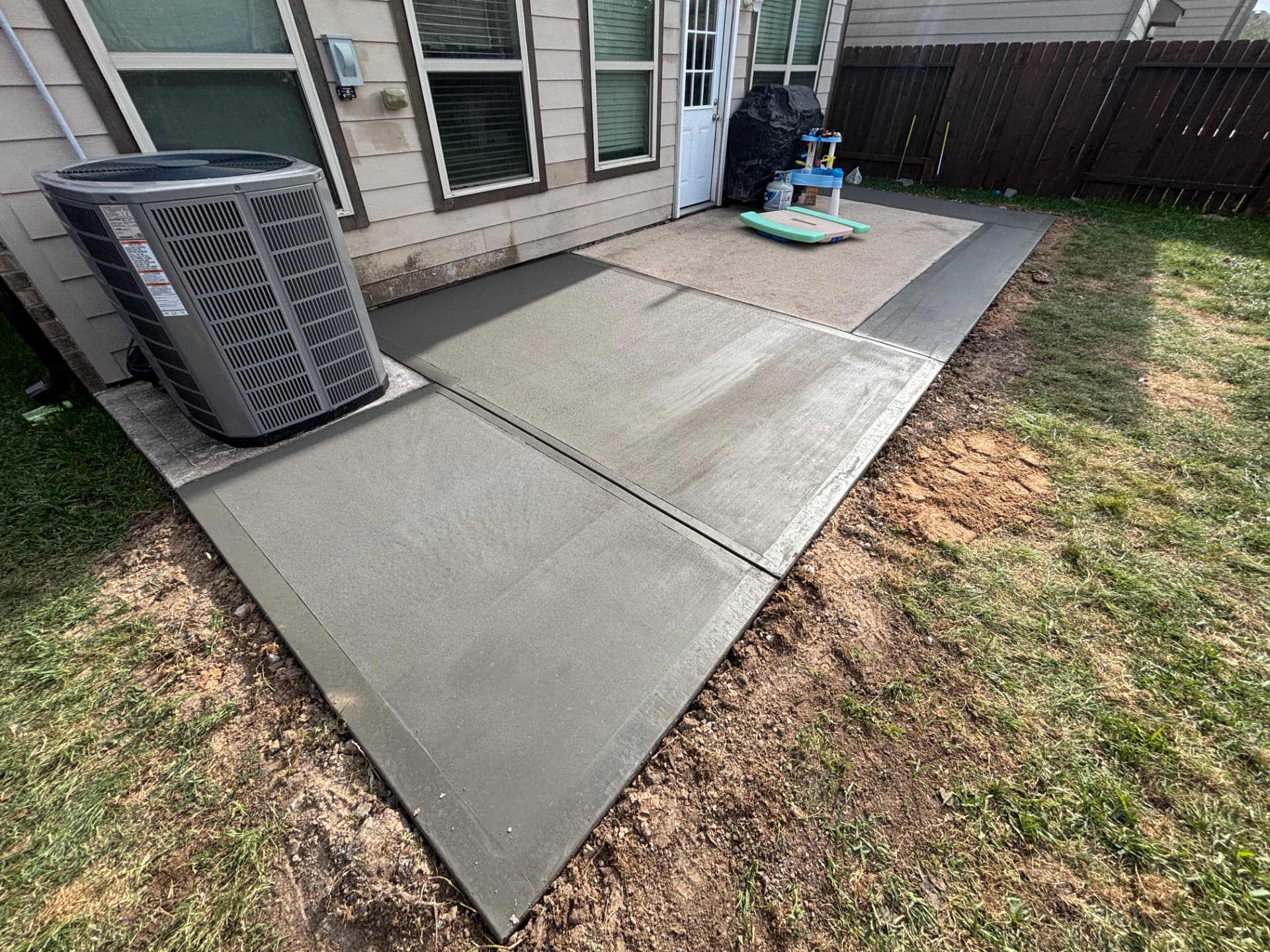 Finished concrete patio extension beside a Bay Area home